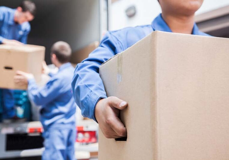 Movers unloading a moving van Movers unloading a moving van